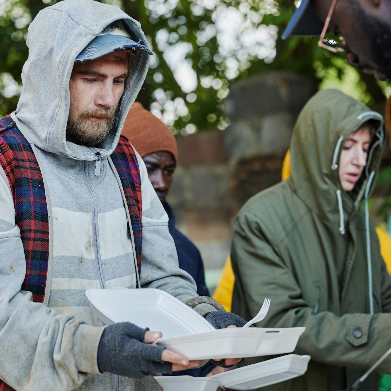 Homeless man coming to eat at food pick-up point