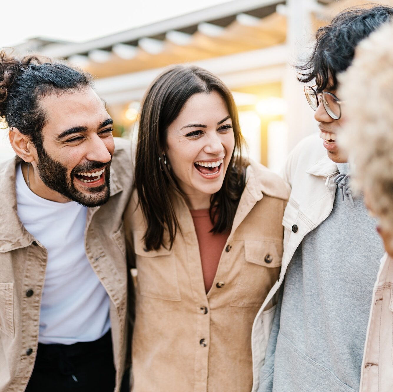 Group of young diverse friends having fun on party at beach